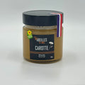 Pot de miel de carotte récolté en France, produit par Abeilles et Miel, présenté avec sa couleur ambrée et une texture riche idéale pour la cuisine et la pâtisserie.