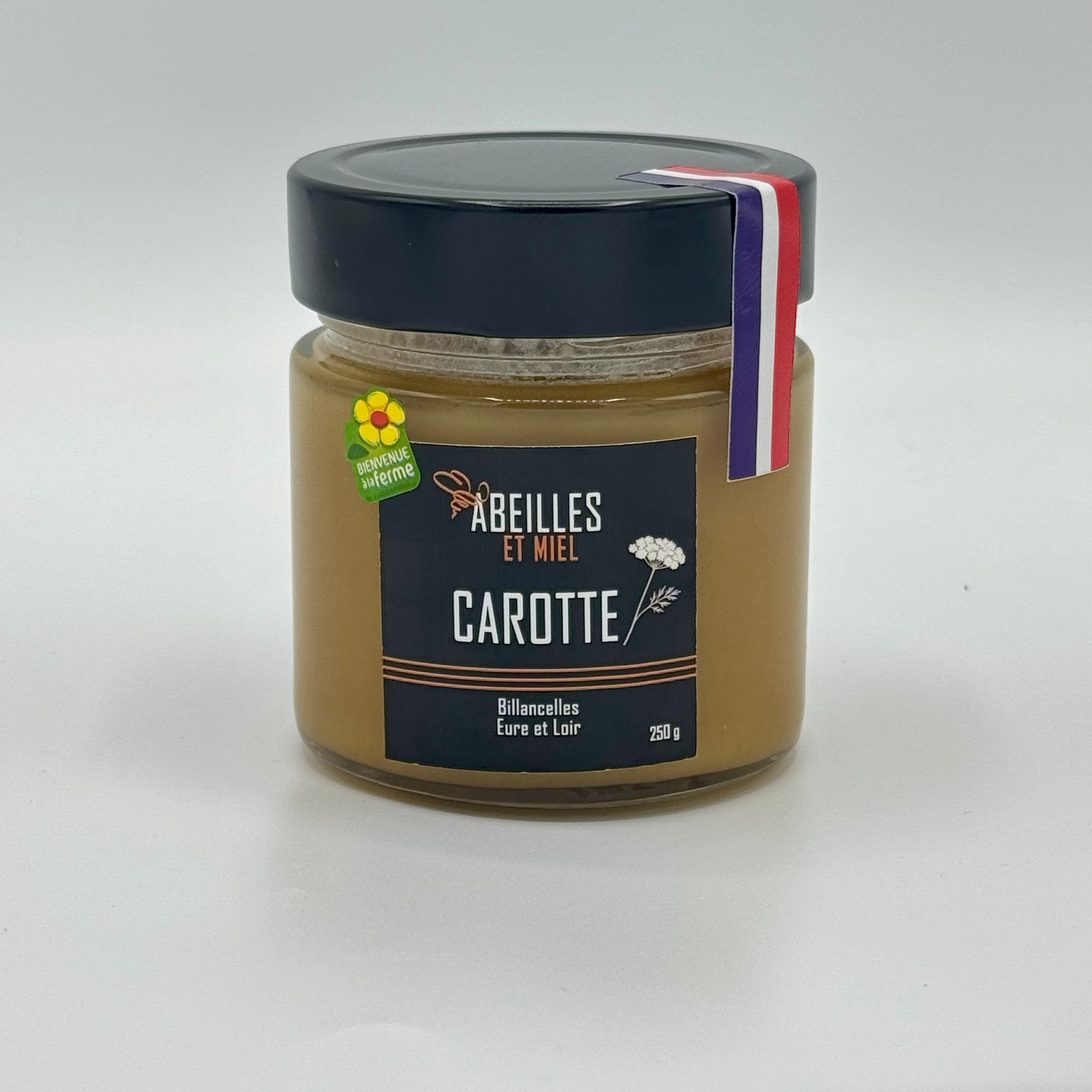Pot de miel de carotte récolté en France, produit par Abeilles et Miel, présenté avec sa couleur ambrée et une texture riche idéale pour la cuisine et la pâtisserie.