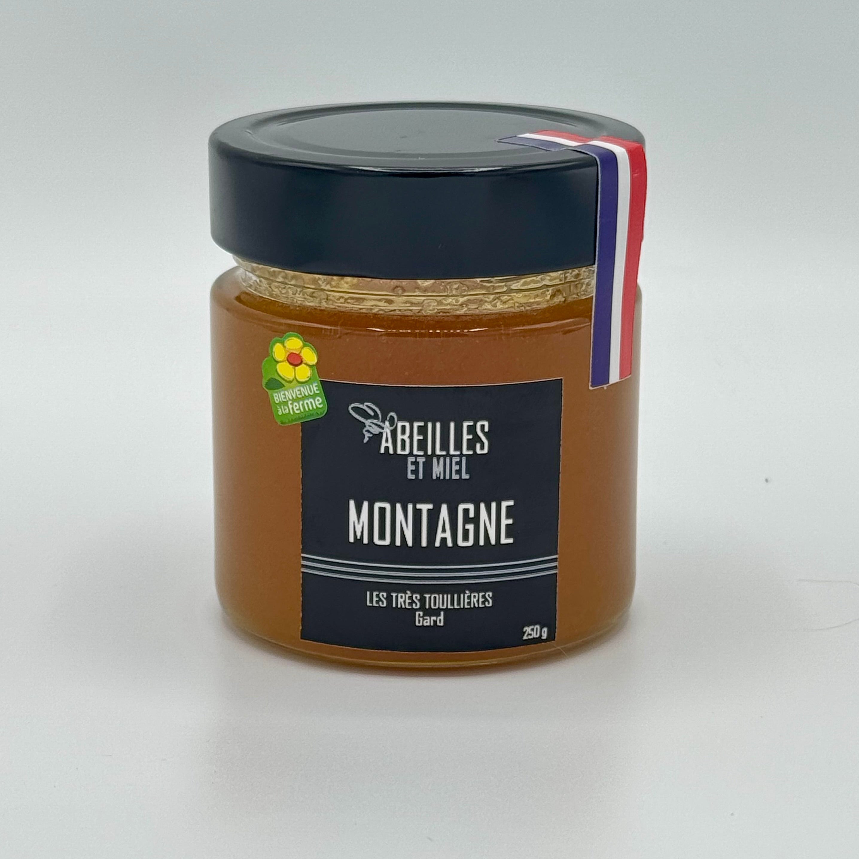 Pot de miel de montagne français, aux arômes floraux et boisés.